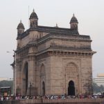 Carving Tools - a large stone building with a crowd of people in front of it with Gateway of India in the background