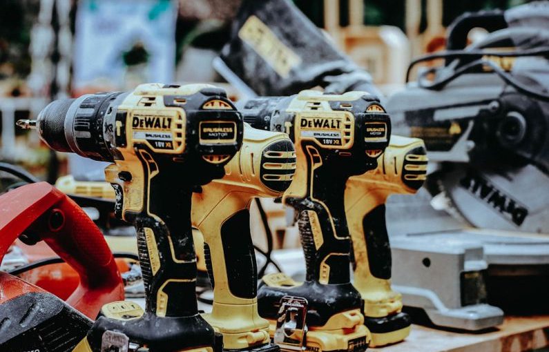 Power Tools - yellow Dewalt hand drills on table