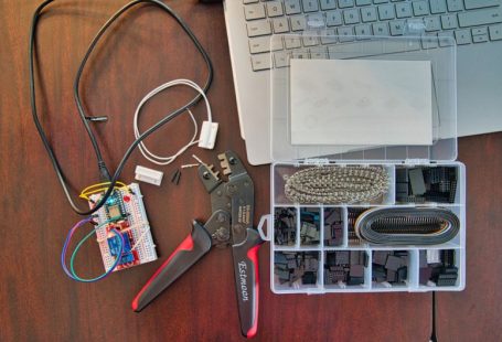 Micro Tools - red and silver scissors beside white laptop computer