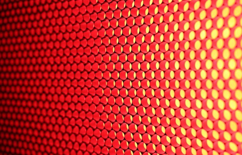Texture Combs - a close up of a red and yellow background