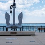Bench Hook - a large metal sculpture sitting on top of a sidewalk
